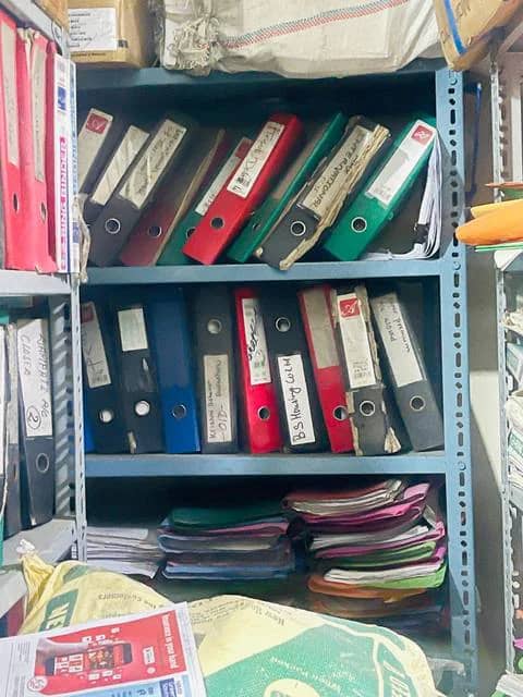 Metal racking filled with mixed binders and files